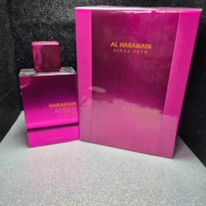 Perfume árabe Al Haramain Amber Oud Ultra Pink para mujer en frasco rosa fucsia con caja original.