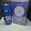 Perfume árabe Asad Zanzibar de Lattafa para hombre en frasco azul con detalles plateados y caja original.