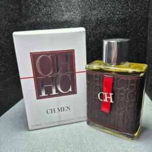 Perfume original Carolina Herrera CH Men para hombre en frasco con forro de cuero marrón, cinta roja y caja original.