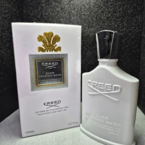 Perfume original Creed Silver Mountain Water en frasco blanco con tapa plateada y caja original.