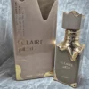 Perfume árabe Lattafa Eclaire para mujer en frasco dorado y café con caja original de lujo.