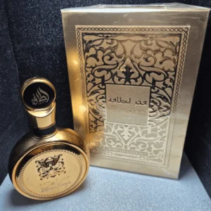Perfume árabe Fakhar Lattafa Gold para mujer en frasco redondo dorado con caja de lujo.