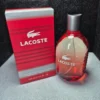 Perfume original Lacoste Red Style in Play para hombre en frasco rojo ovalado con caja original.