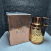 Perfume árabe Armaf Odyssey Aoud para hombre en frasco dorado y negro con caja original.