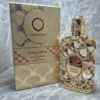 Perfume árabe Orientica Royal Amber unisex en frasco dorado con diseño de malla calada y caja original de lujo.