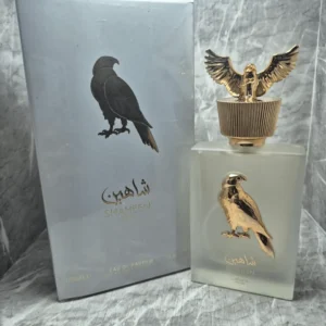 Perfume árabe Lattafa Pride Shaheen Silver para hombre con tapón de halcón dorado y caja original.