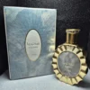 Perfume árabe Victoria de Lattafa para mujer en frasco redondo celeste y dorado con caja original.