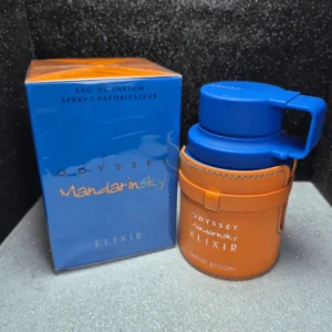Perfume árabe Armaf Odyssey Mandarin Sky Elixir para hombre en frasco naranja con detalles de cuero y caja original.
